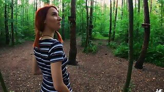 Redhead slut Elin gets down on her knees to suck a dick outdoors